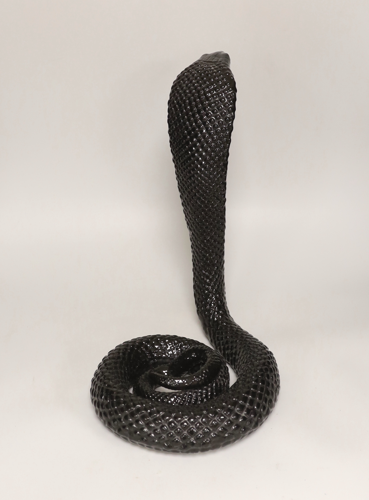 A porcelain model of a king cobra, 38cm tall